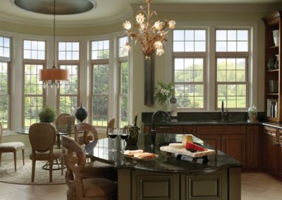 Tuscany Series vinyl single hung windows with grids in tan